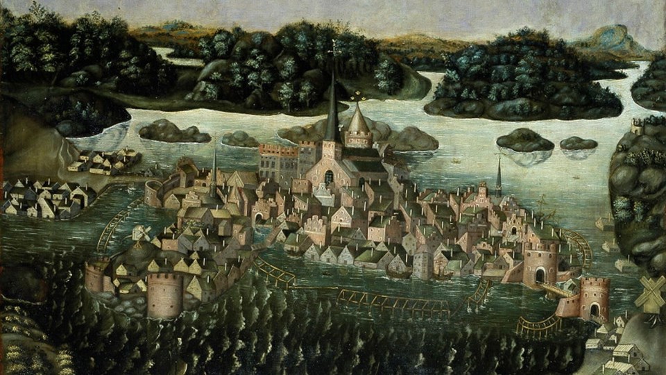 Målning över medeltidsstad.